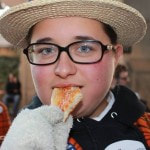 Picture of person eating pizza